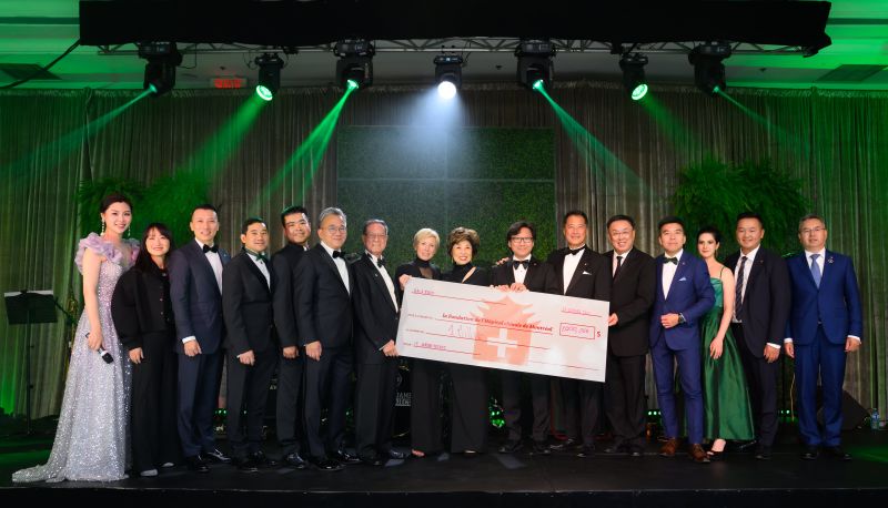 Cheque presentation on stage at the 2023 MCHF Gala