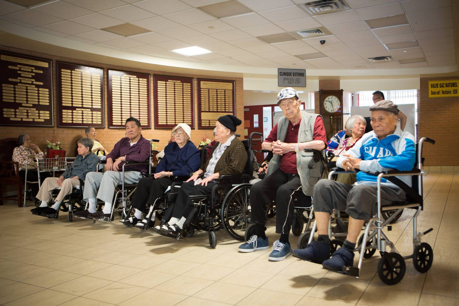 Residents gathered in the Hospital lobby beside the donor recognition wall