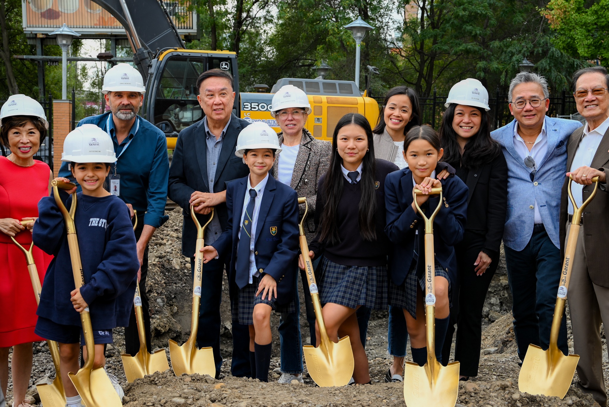 Donors and students with shovels at the garden groundbreaking
